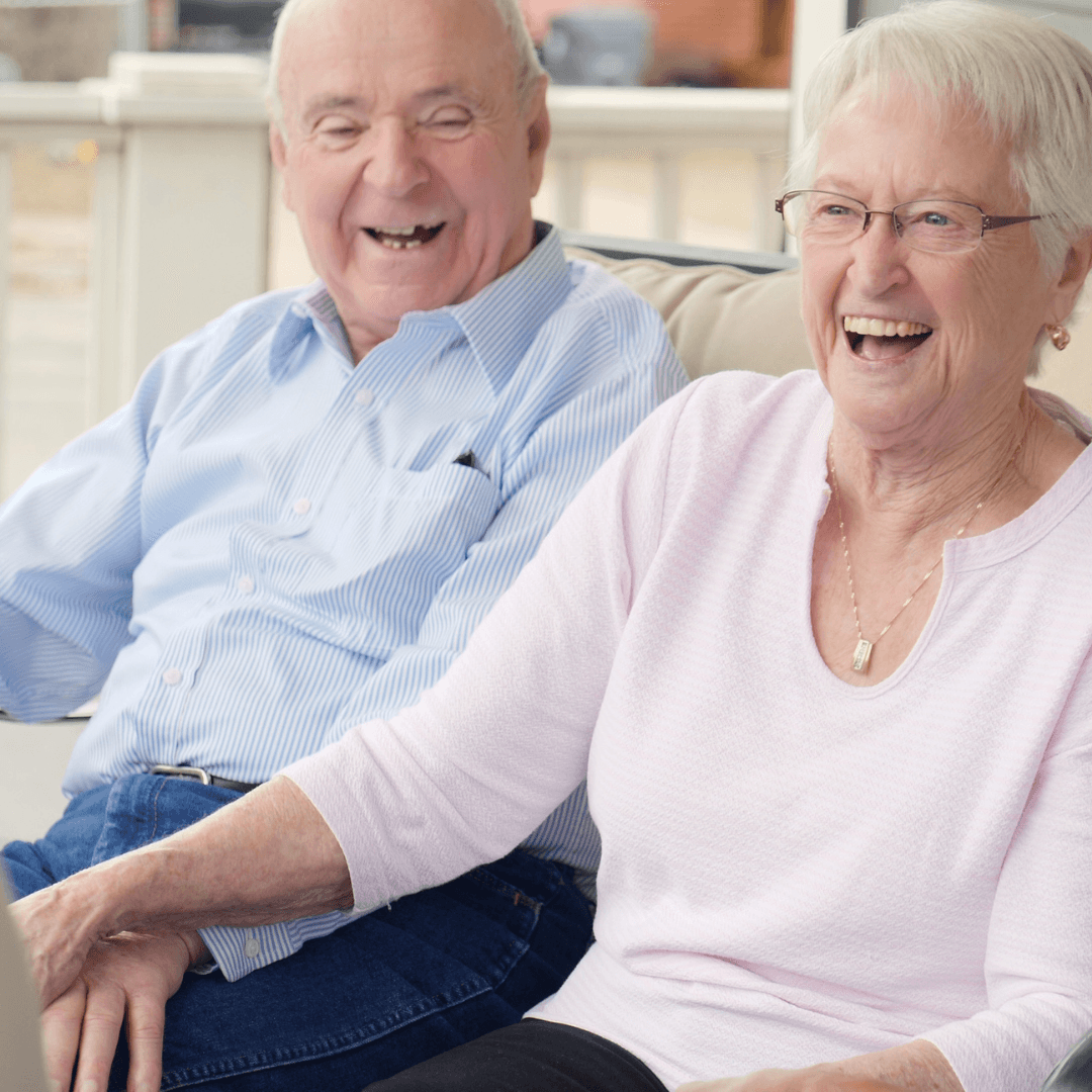 Senior couple holding hands